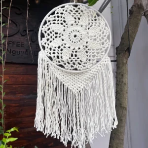 Crochet dreamcatcher wall hanging with intricate mandala pattern, handmade from natural cotton yarn